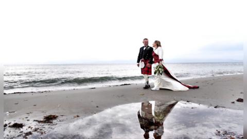 Tartan wedding dress on beach