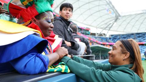 Desiree Ellis (right) with a South Africa fan at the Women's World Cup