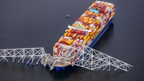 In an aerial view, cargo ship Dali is seen after running into and collapsing the Francis Scott Key Bridge in Baltimore