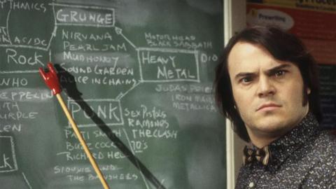 Jack Black in School of Rock standing at a chalkboard 