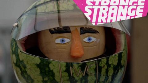 A racing car driver carved from a watermelon and some veg