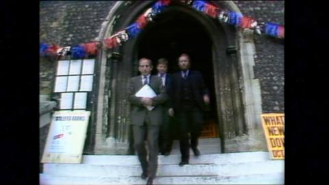 Lawyers leaving a courthouse.