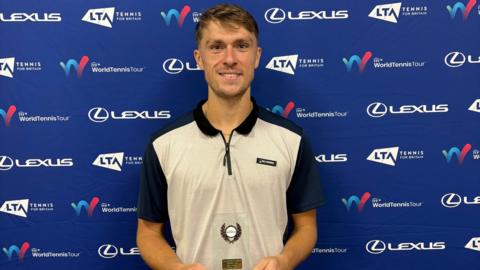 James Story poses with his winning trophy