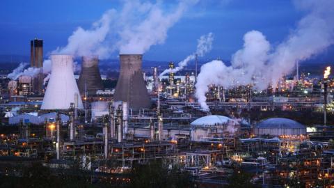 A night time view of the Grangemouth plant and oil refinery, with fumes going  into the sky. 