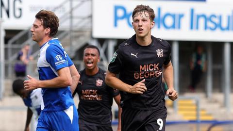 Harry Leonard (right) scores for Peterborough