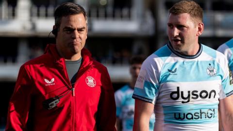 Johann van Graan (left) and Finn Russell (middle) at half-time of a Challenge Cup match this season