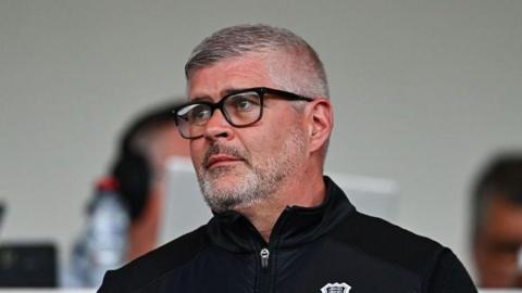 Steve Curwood looks out at the match action for Fleetwood's sister club Waterford in the League of Ireland.