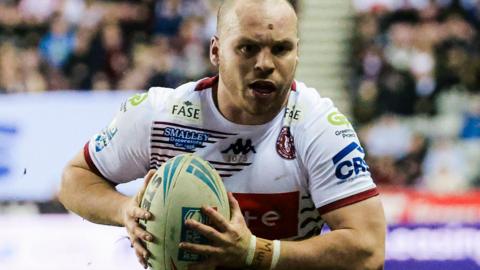 Wigan Warriors winger Liam Marshall running with the ball in his hands