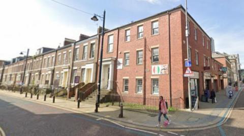 Building at St Thomas Street, Sunderland, proposed for apartments. It is a large three storey red brick building on the end of a terrace.