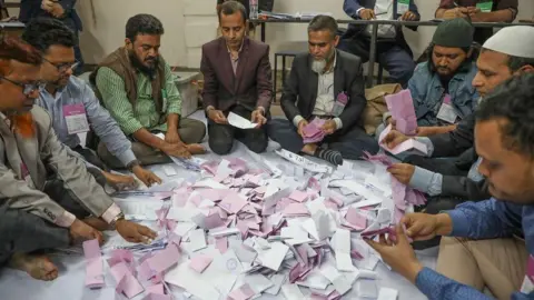 Bangladesh election officials count ballot papers after voting ends at the Barnamala Adarsha School and College polling centre in Dania, at Dhaka Government Muslim High School in Dhaka, Bangladesh, 12 February 2026