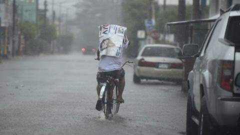 A resident rides his bike along a street as the Hurricane Willa arrives to Escuinapa, Sinaloa state, Mexico, on October 23, 2018