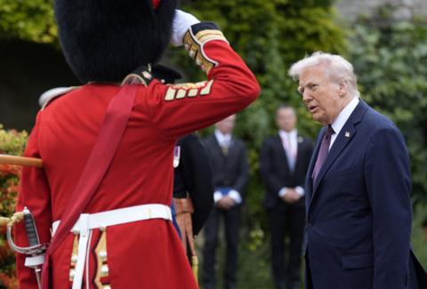 US President Donald Trump looks on following a Beating Retreat military ceremony at Windsor Castle, Berkshire, on day one of the president's second state visit to the UK.