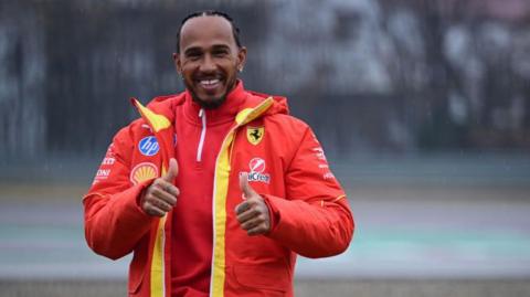 Lewis Hamilton giving a thumbs up after his first Ferrari test drive