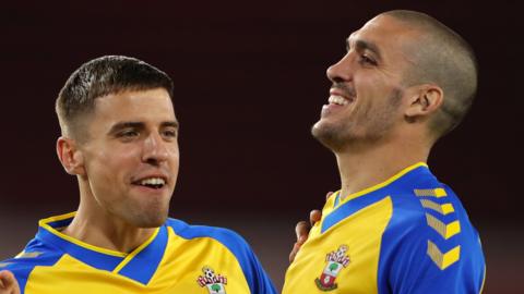 Oriol Romeu celebrates after scoring the winning penalty