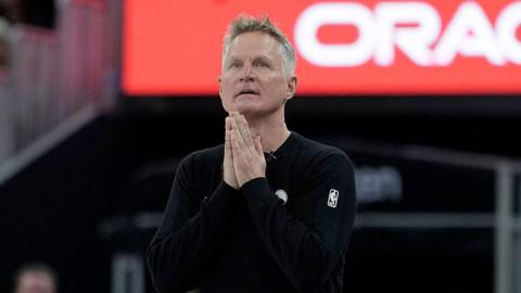 Golden State Warriors Steve Kerr holds his hands together during their win over the Minnesota Timberwolves