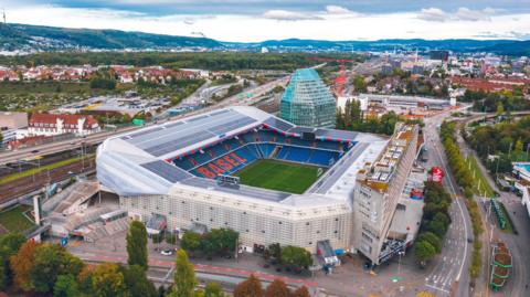 A football stadium with hills behind in the Swiss city of Basel.
