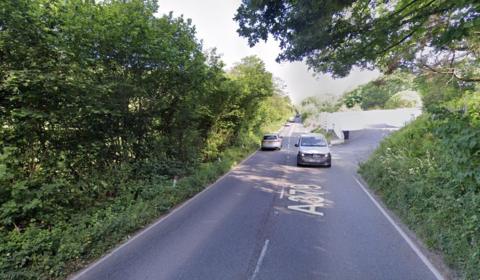 Car travelling on the A379 near Aveton Gifford