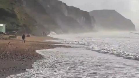 Fossil seekers filmed at Charmouth following the storm
