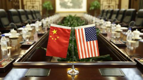 Flags of the US and China are placed ahead of a meeting between US Secretary of Agriculture Sonny Perdue and China's Agriculture Minister Han Changfu at the Ministry of Agriculture in Beijing on June 30, 2017.