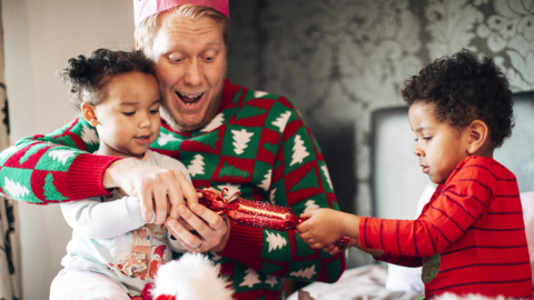 Two children pulling a Christmas cracker