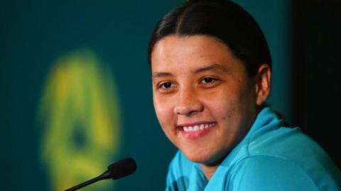 Sam Kerr smiles during a press conference