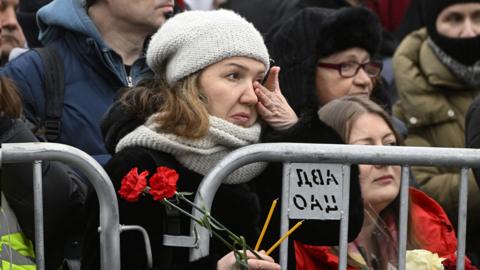 Mourners gather in front of the church ahead of a funeral service for Alexei Navalny