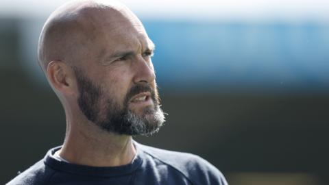 Notts County boss Luke Williams looks across the pitch