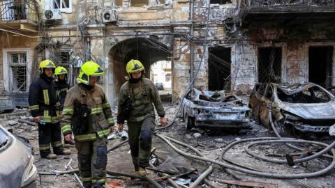 Emergency workers at the scene of an attack in Odesa on 9 August