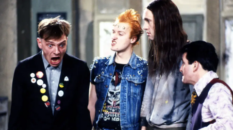 Rik in character in The Young Ones with other actors in the BBC series.