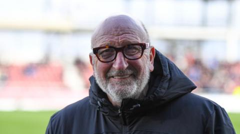 Paul Hart, wearing glasses, in his last role as assistant manager of Charlton 