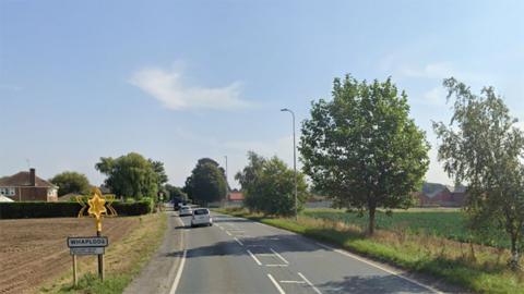 Whaplode road and village sign