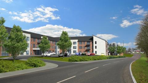 A CGI image shows what one of the buildings might look like. It is three-storey and T- shaped, with sections of white render between brown brick walls. The area in front of the building contains a ground level car park and manicured lawns with a few trees and low bushes. A road runs past the building into the distance.