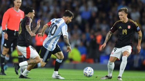 Burnley defender Oliver Sonne facing Lionel Messi for Peru