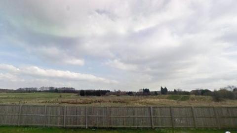 Where the former Whitwell Main Colliery was in Streethouse. Picture shows empty field and the fence of someone's back garden.