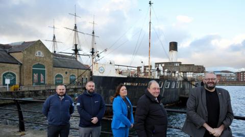 Pictured beside PS Wingfield Castle are (from left) Southbay Civil Engineering’s Senior Site Agent Ashley Raine and Contracts Manager Stephen Truscott, Hartlepool Borough Council Managing Director Denise McGuckin, Councillor Bob Buchan