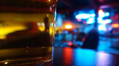 A beer glass in a bar