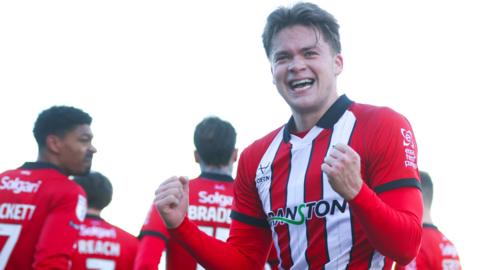 Freddie Draper celebrates scoring Lincoln City's second goal against Peterborough United