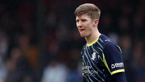Crewe defender James Connolly in action