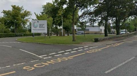 A secondary school entrance and road