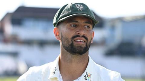 Close up of Brett D'Oliveira in his green Worcestershire cap