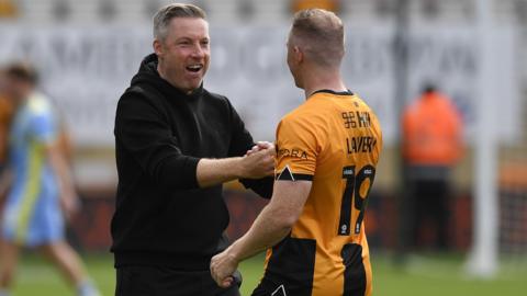 Neil Harris congratulates Shane Lavery following Saturday's league win over Fleetwood