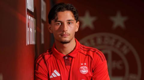 Kenan Bilalovic poses for photos at Pittodrie