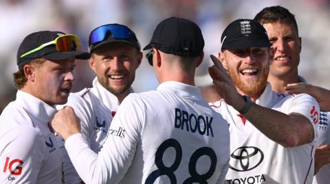 England players celebrate a wicket