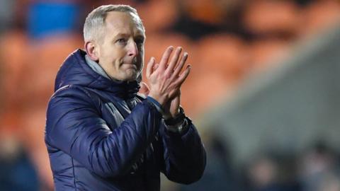 Neil Critchley applauds after Blackpool's loss to Nottingham Forest