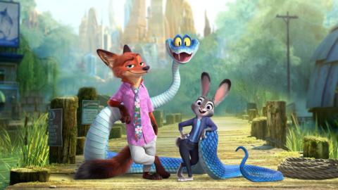 Animated characters Nick Wilde the fox, a blue snake and judie Hopps the rabbit standing together on a wooden jetty.