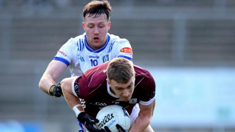 Monaghan's Michael Bannigan tackles Galway's John Daly