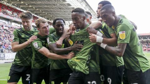 Bournemouth celebrate their opening goal against Bristol City with team-mate David Brooks' shirt