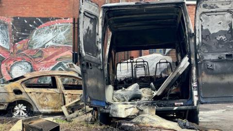 Burnt out van at the scene