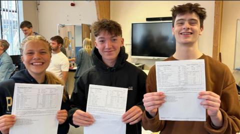 Alice Otis and Flynn with open GCSE results at Downlands Community School