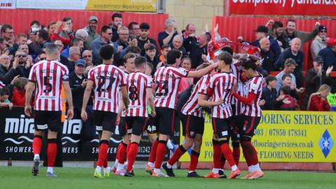 Cheltenham Town players celebrate George Miller's winner